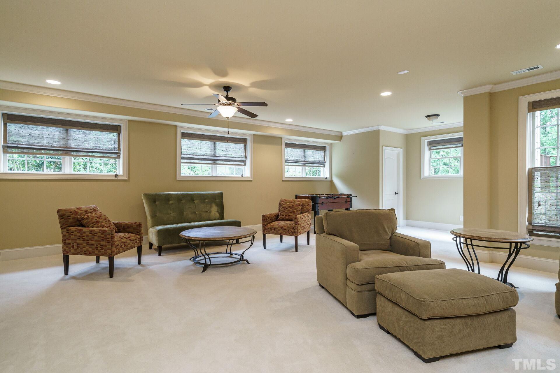 8313 Rue Cassini Court Raleigh, NC 27615 - Photo 41 of 74 a living room with furniture and a window