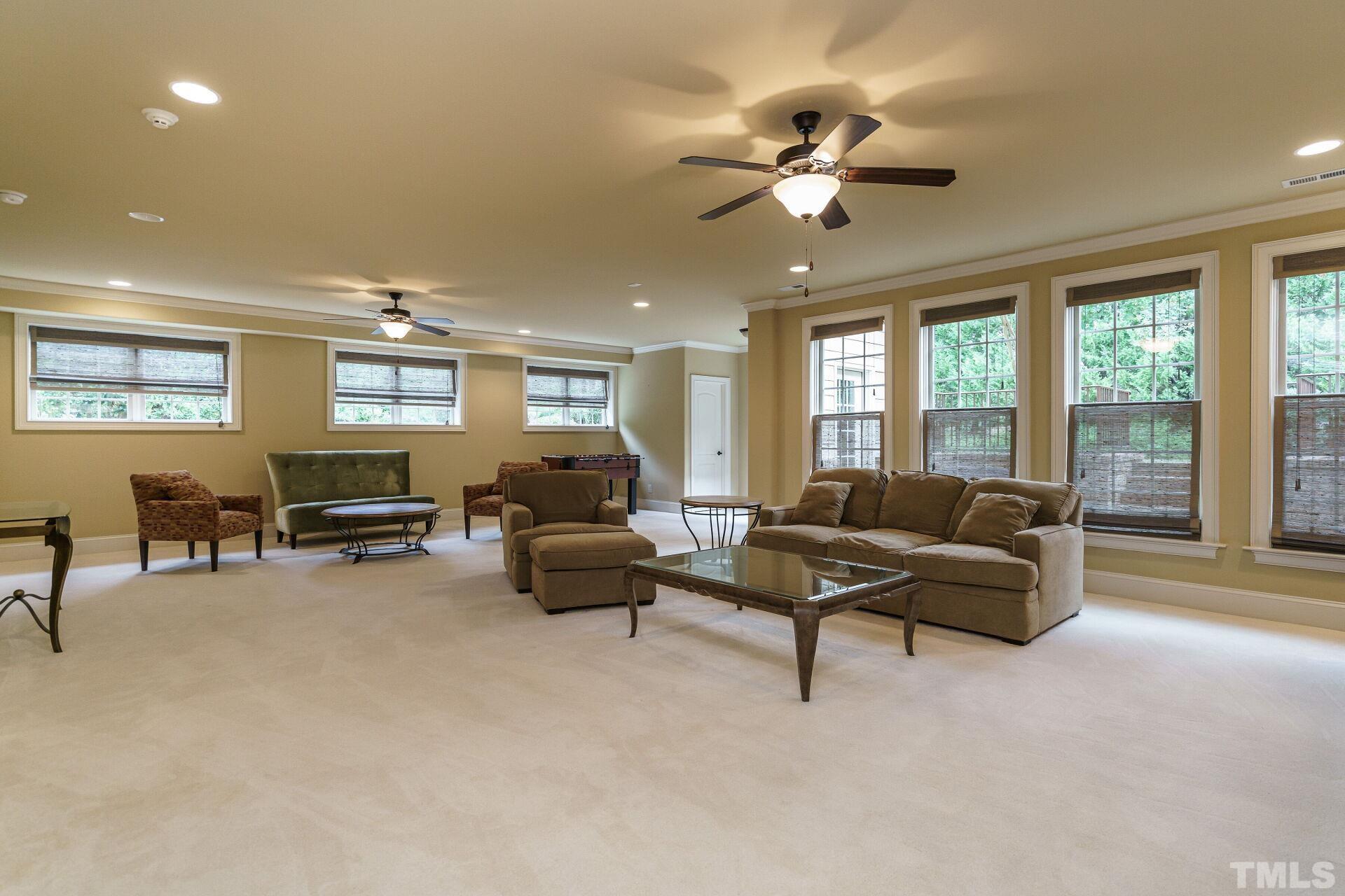 8313 Rue Cassini Court Raleigh, NC 27615 - Photo 44 of 74 a living room with furniture and a large window