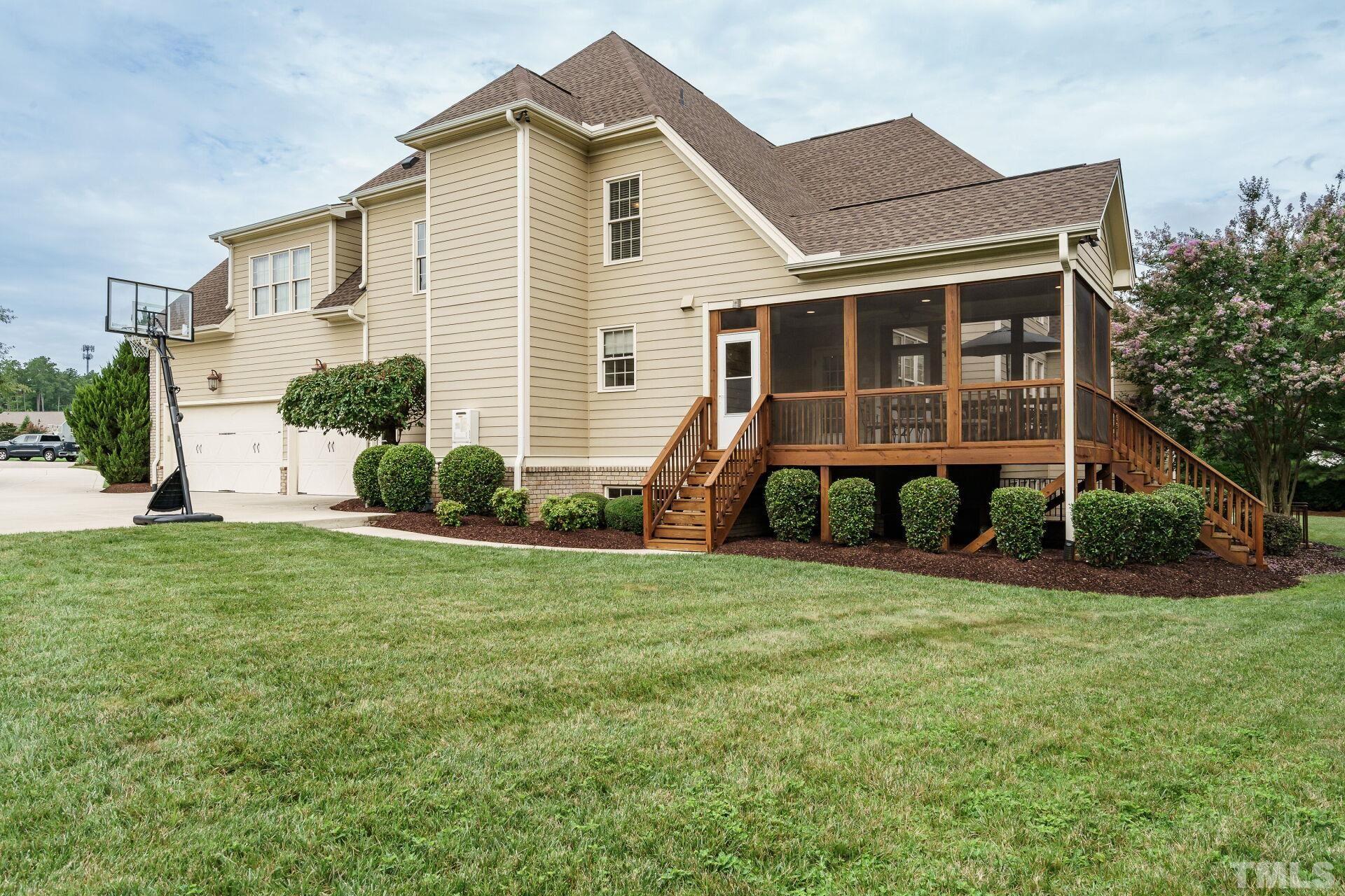8313 Rue Cassini Court Raleigh, NC 27615 - Photo 53 of 74 a front view of a house with a yard and garage