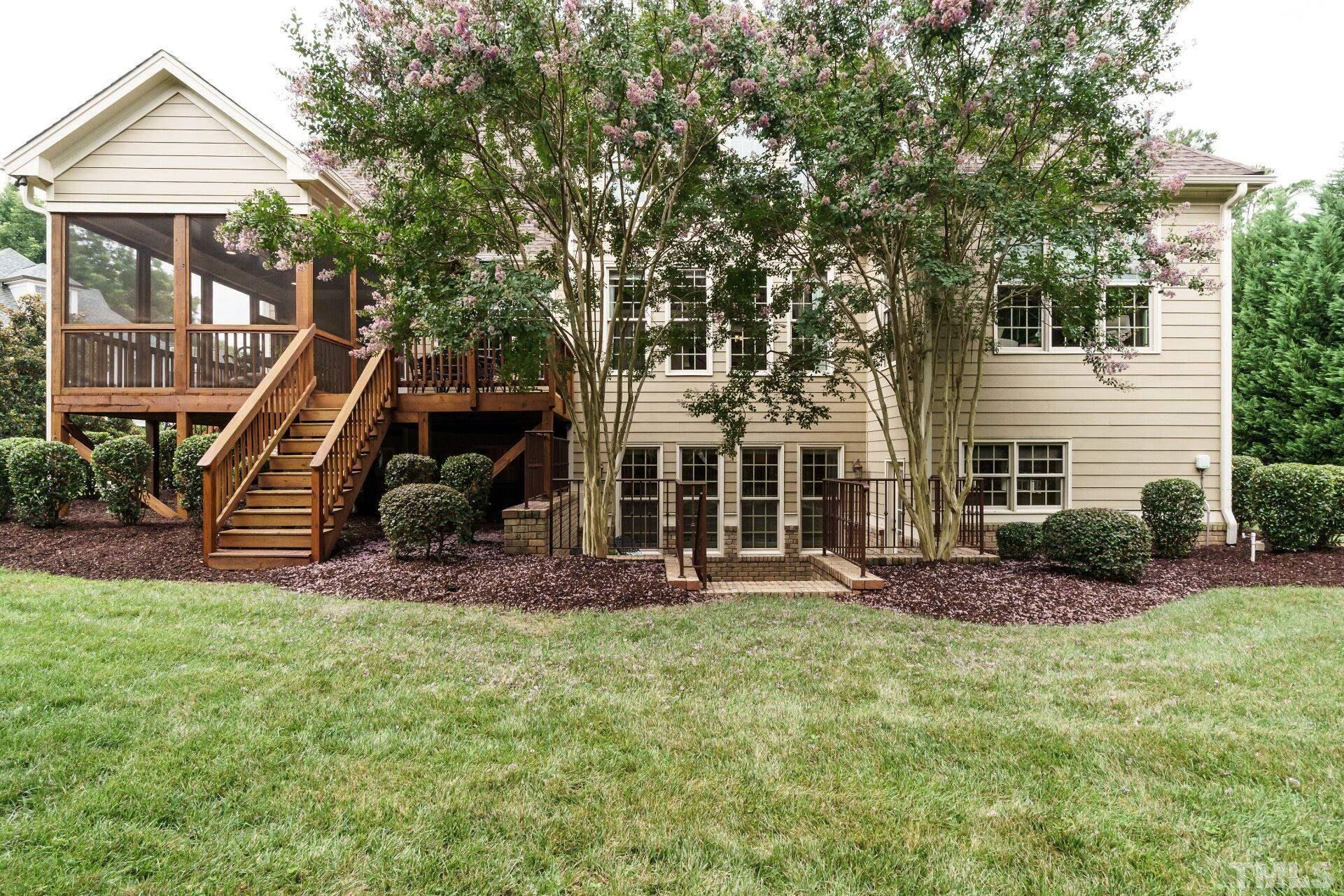 8313 Rue Cassini Court Raleigh, NC 27615 - Photo 55 of 74 a front view of a house with a yard