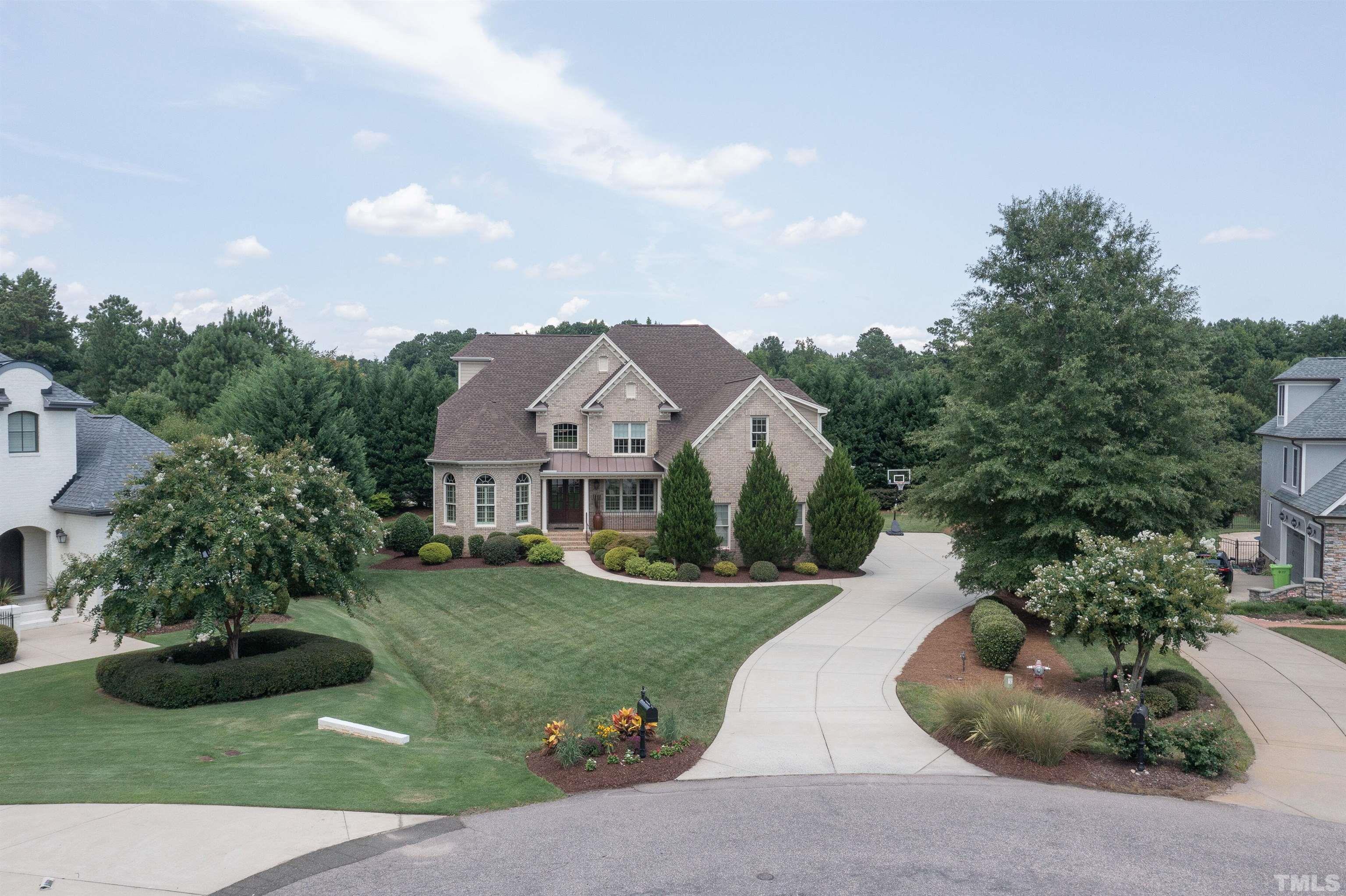 8313 Rue Cassini Court Raleigh, NC 27615 - Photo 58 of 74 a front view of a house with garden
