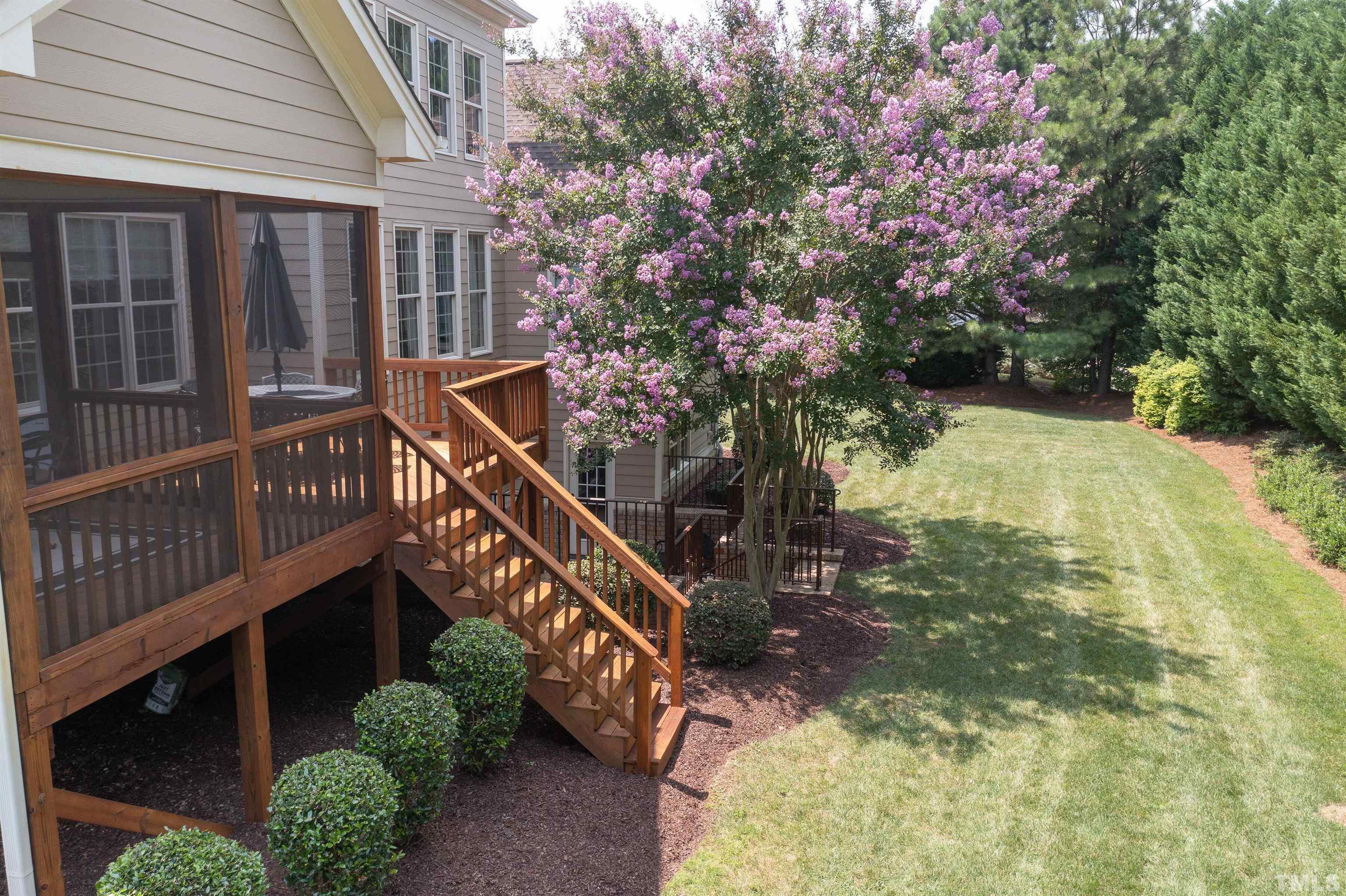 8313 Rue Cassini Court Raleigh, NC 27615 - Photo 68 of 74 a balcony with flower plants and wooden fence