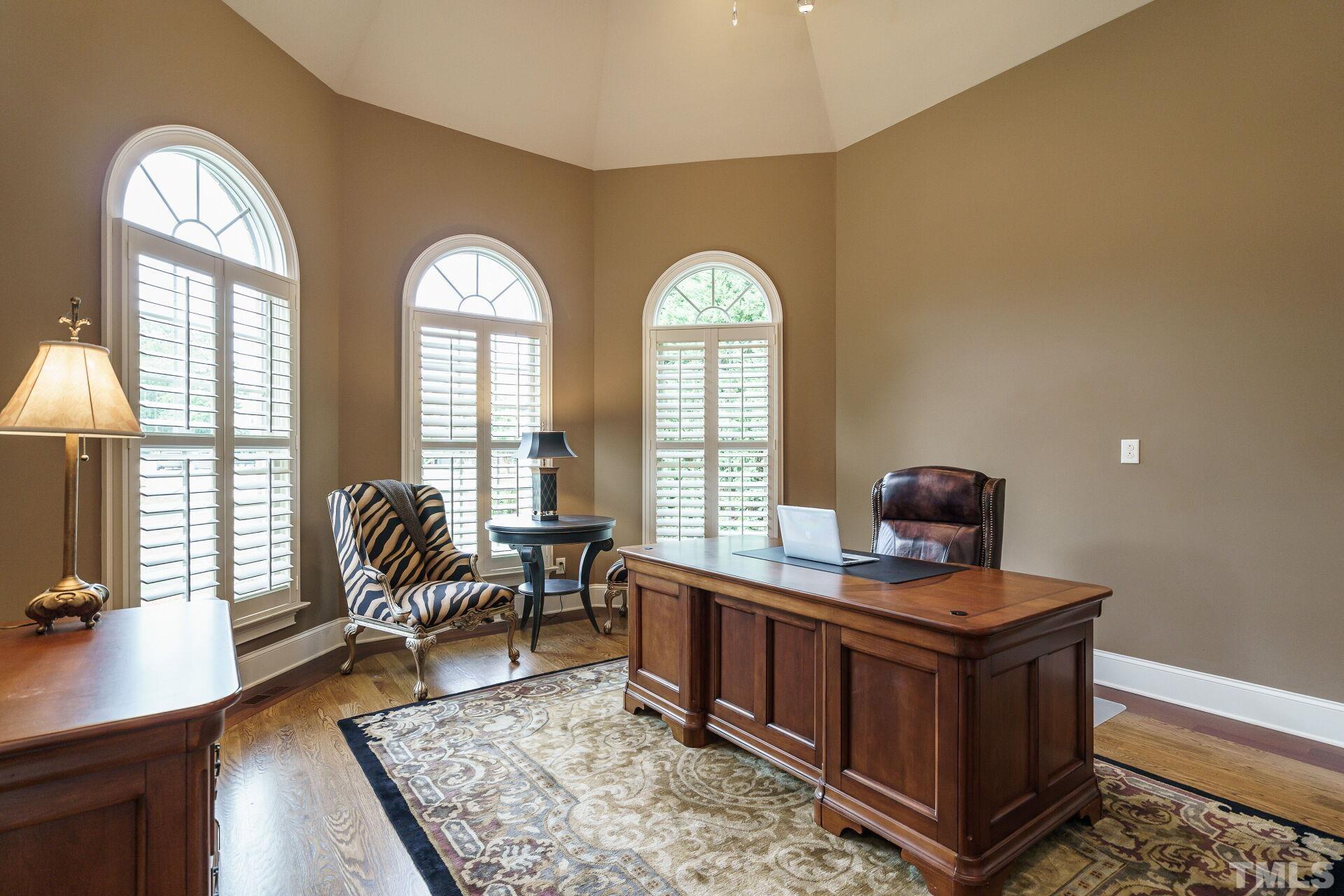 8313 Rue Cassini Court Raleigh, NC 27615 - Photo 8 of 74 a living room with furniture and a floor to ceiling window