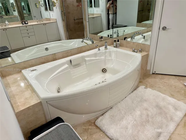 a bathroom with a bathtub and a sink