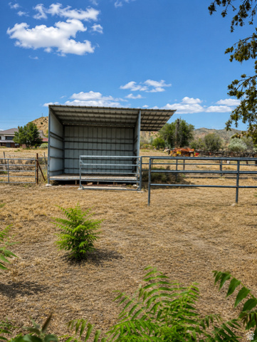 1766 Kenilworth Road Spring Glen, UT 84526 - Photo 21 of 24 Metal shelter structure on a dry, open lot