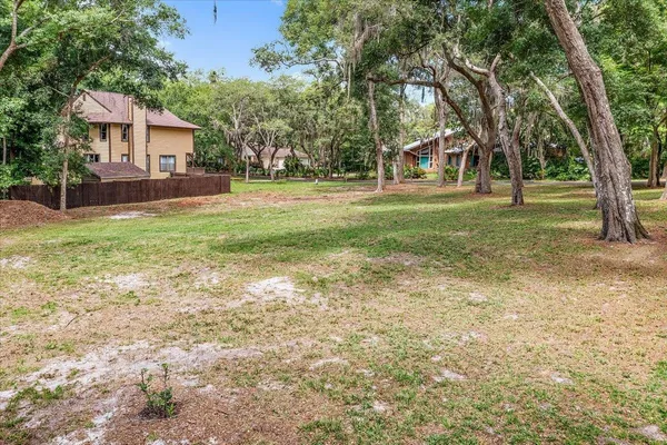 a view of house with outdoor space and garden