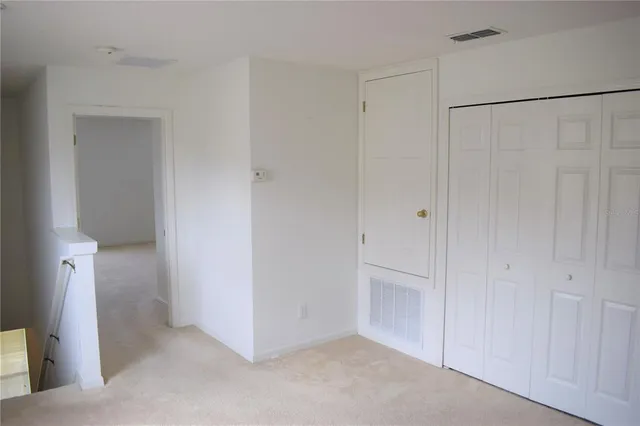 an empty room with a bathroom