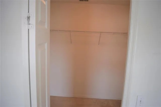 an empty room with a ceiling fan