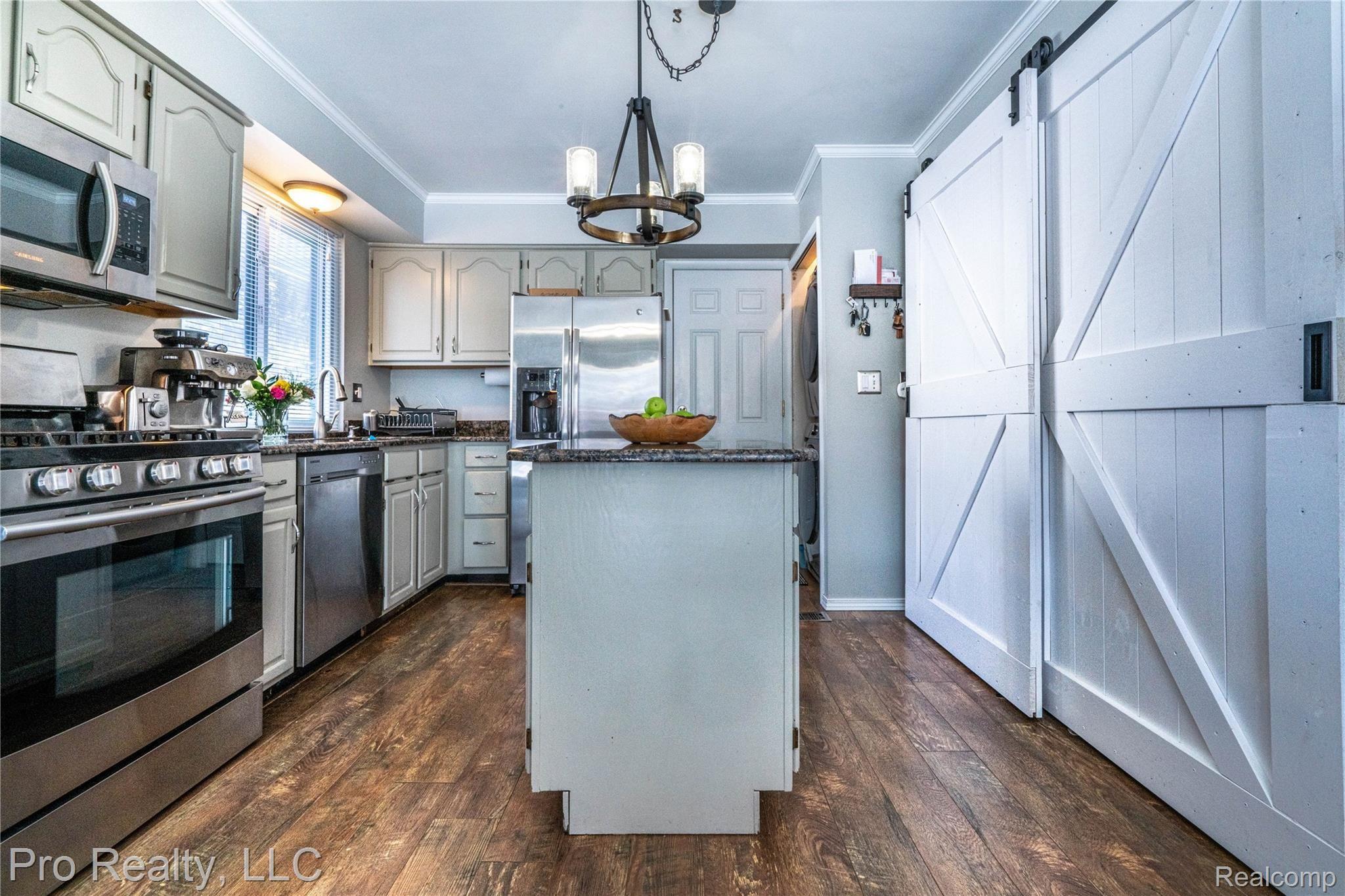 22697 Shadowpine Way Novi, MI 48375 - Photo 8 of 24 updated kitchen, island and barn door