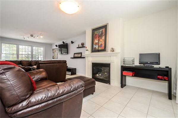 549 Potter Road Framingham, MA 01701 - Photo 11 of 22 a living room with furniture or flat screen tv and a fireplace