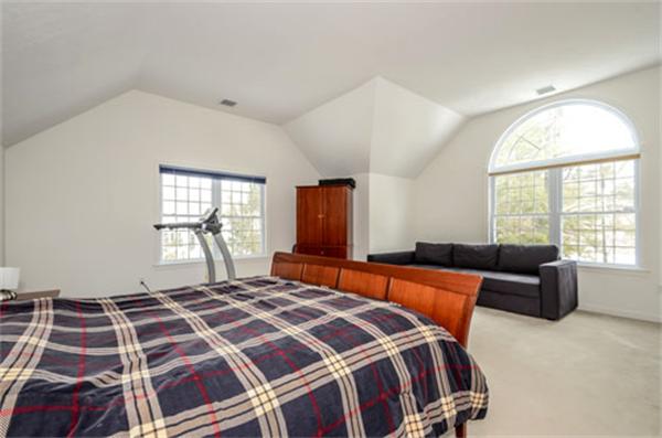 549 Potter Road Framingham, MA 01701 - Photo 14 of 22 a bedroom with a large bed and a window