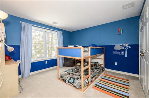 549 Potter Road Framingham, MA 01701 - Photo 16 of 22 a bedroom with a bed and a dresser