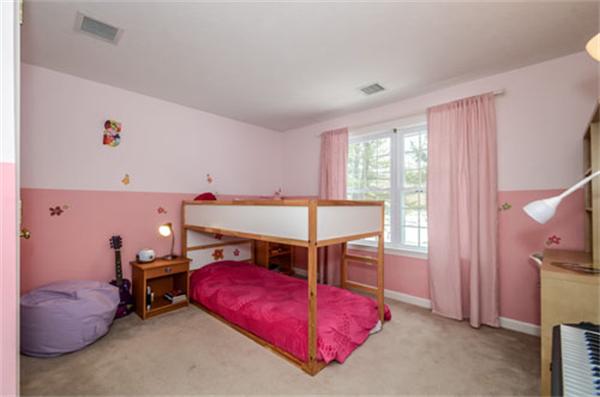 549 Potter Road Framingham, MA 01701 - Photo 17 of 22 a bedroom with furniture and a chandelier