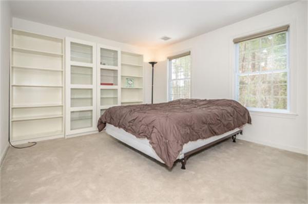 549 Potter Road Framingham, MA 01701 - Photo 18 of 22 a bedroom with a bed and a window