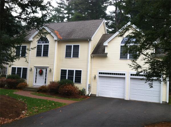 549 Potter Road Framingham, MA 01701 - Photo 21 of 22 a front view of a house with a yard and garage