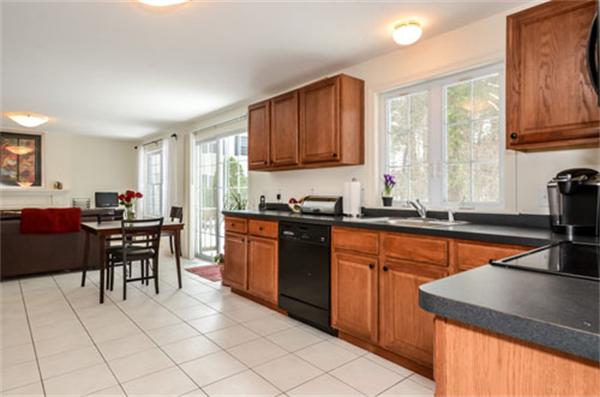 549 Potter Road Framingham, MA 01701 - Photo 4 of 22 a kitchen with stainless steel appliances granite countertop sink stove top oven and cabinets