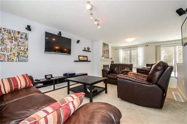 549 Potter Road Framingham, MA 01701 - Photo 9 of 22 a living room with furniture and a flat screen tv