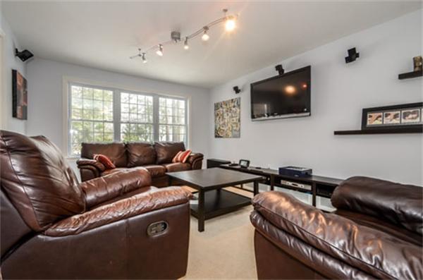 549 Potter Road Framingham, MA 01701 - Photo 10 of 22 a living room with furniture and a flat screen tv