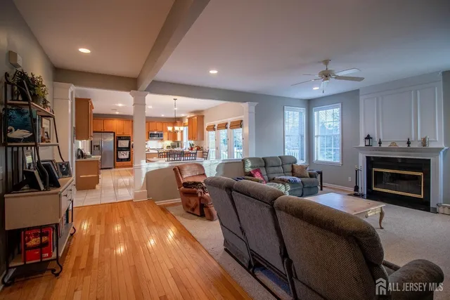 a living room with furniture and a fireplace