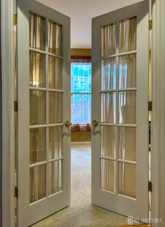 a view of a livingroom with wooden floor and a window