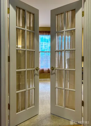 a view of a livingroom with wooden floor and a window