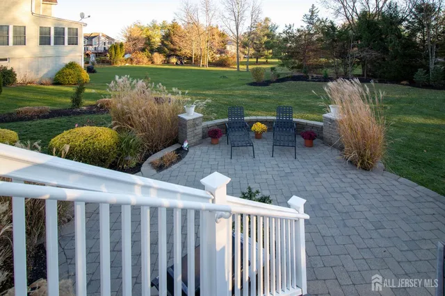 a view of a wooden deck with back yard
