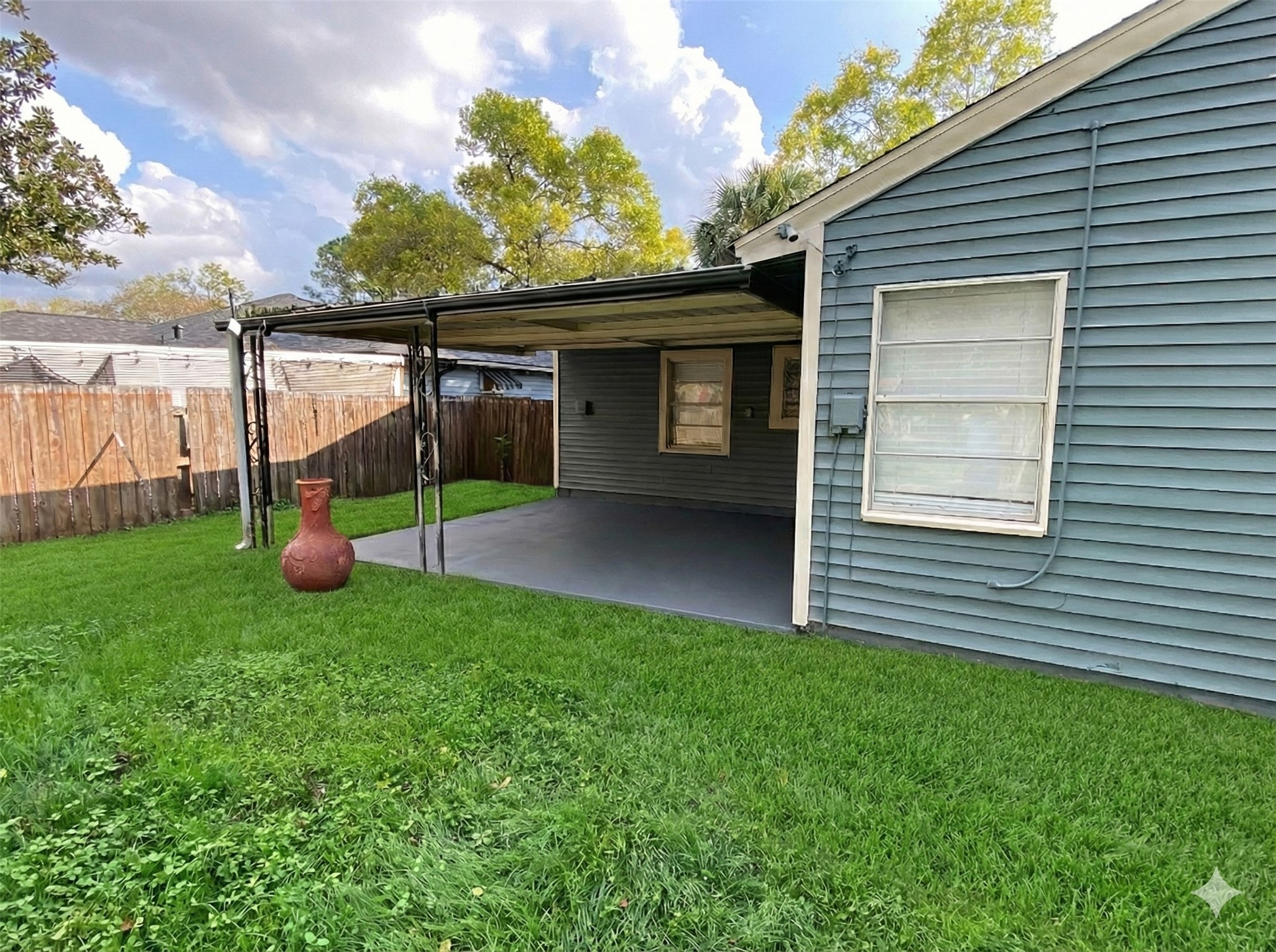 1021 Wimberly Street Angleton, TX 77515 - Photo 12 of 14 a view of a small house with a backyard