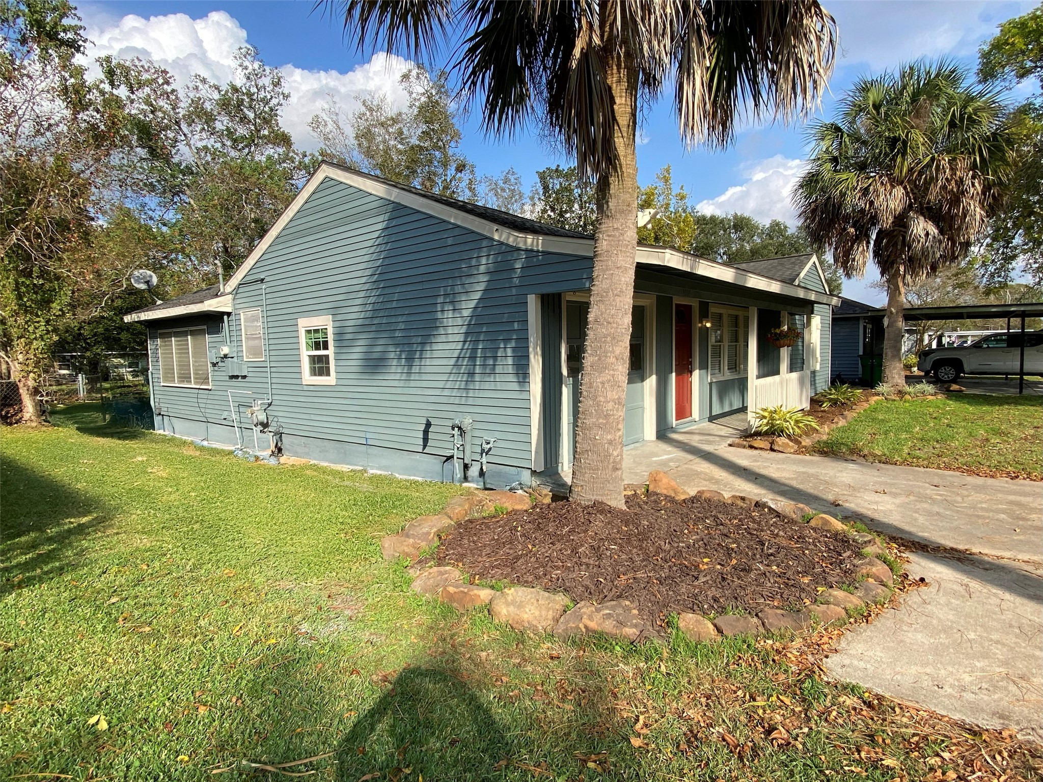 1021 Wimberly Street Angleton, TX 77515 - Photo 3 of 14 a house with palm tree in front of it