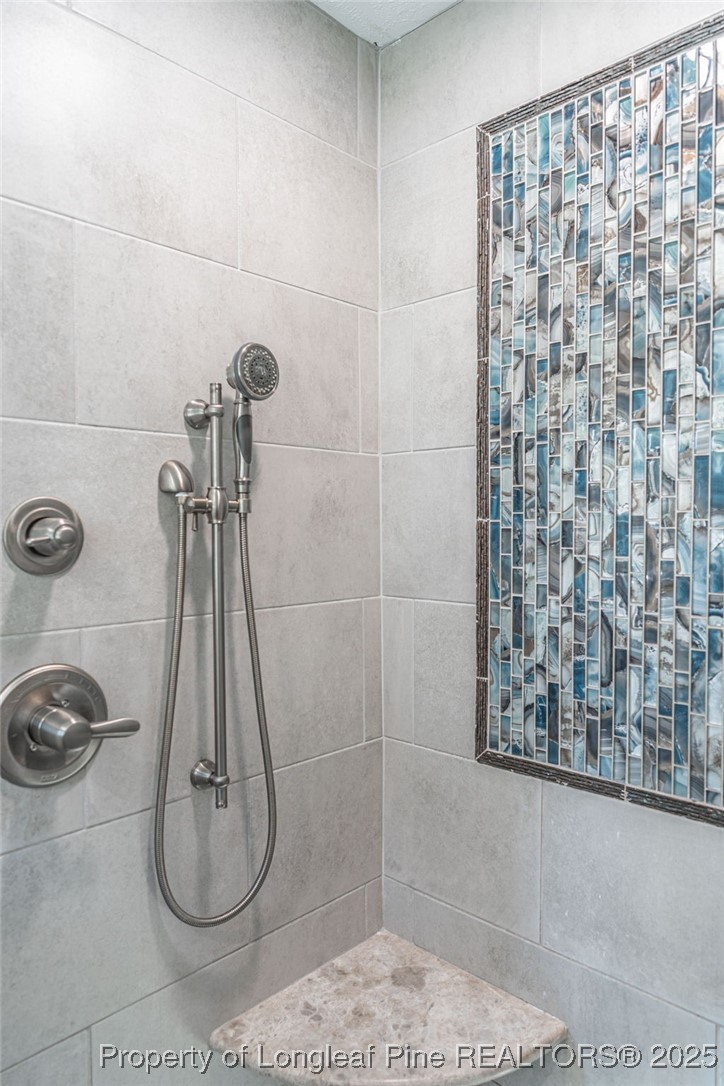 255 Foxcroft Road Whispering Pines, NC 28327 - Photo 27 of 31 a bathroom with a shower