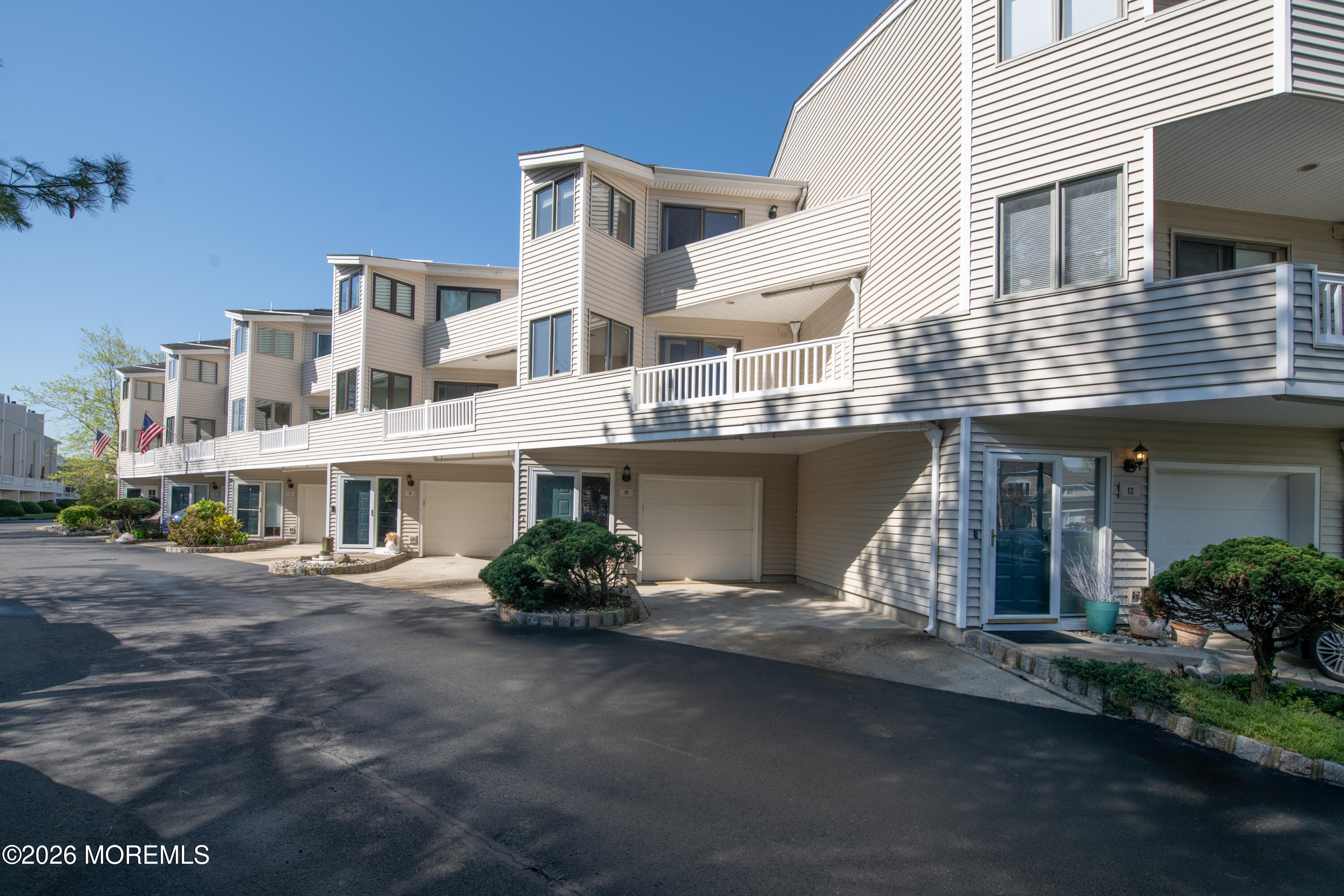 10 Seawinds Way Long Branch, NJ 07740 - Photo 1 of 31 a front view of a building with garden