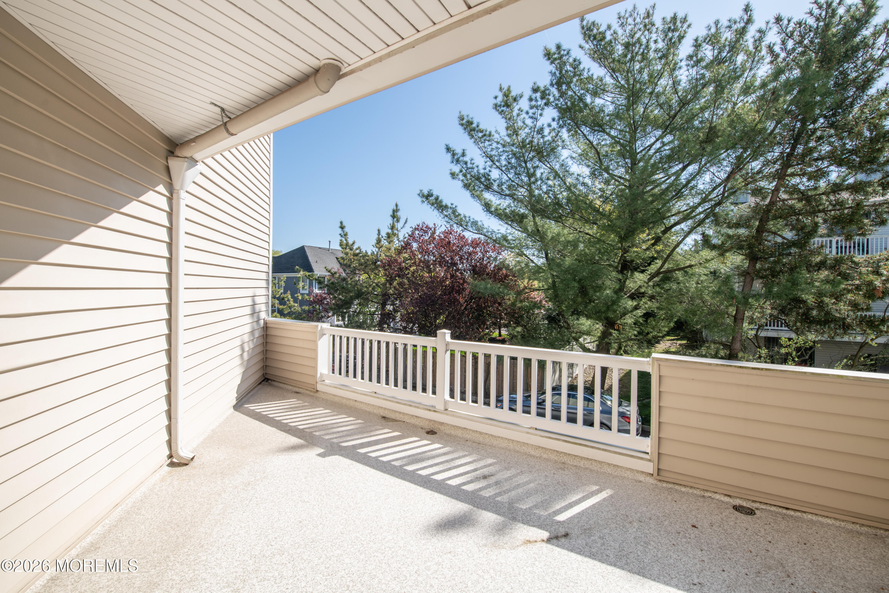 10 Seawinds Way Long Branch, NJ 07740 - Photo 13 of 31 a view of a roof deck with wooden fence and floor