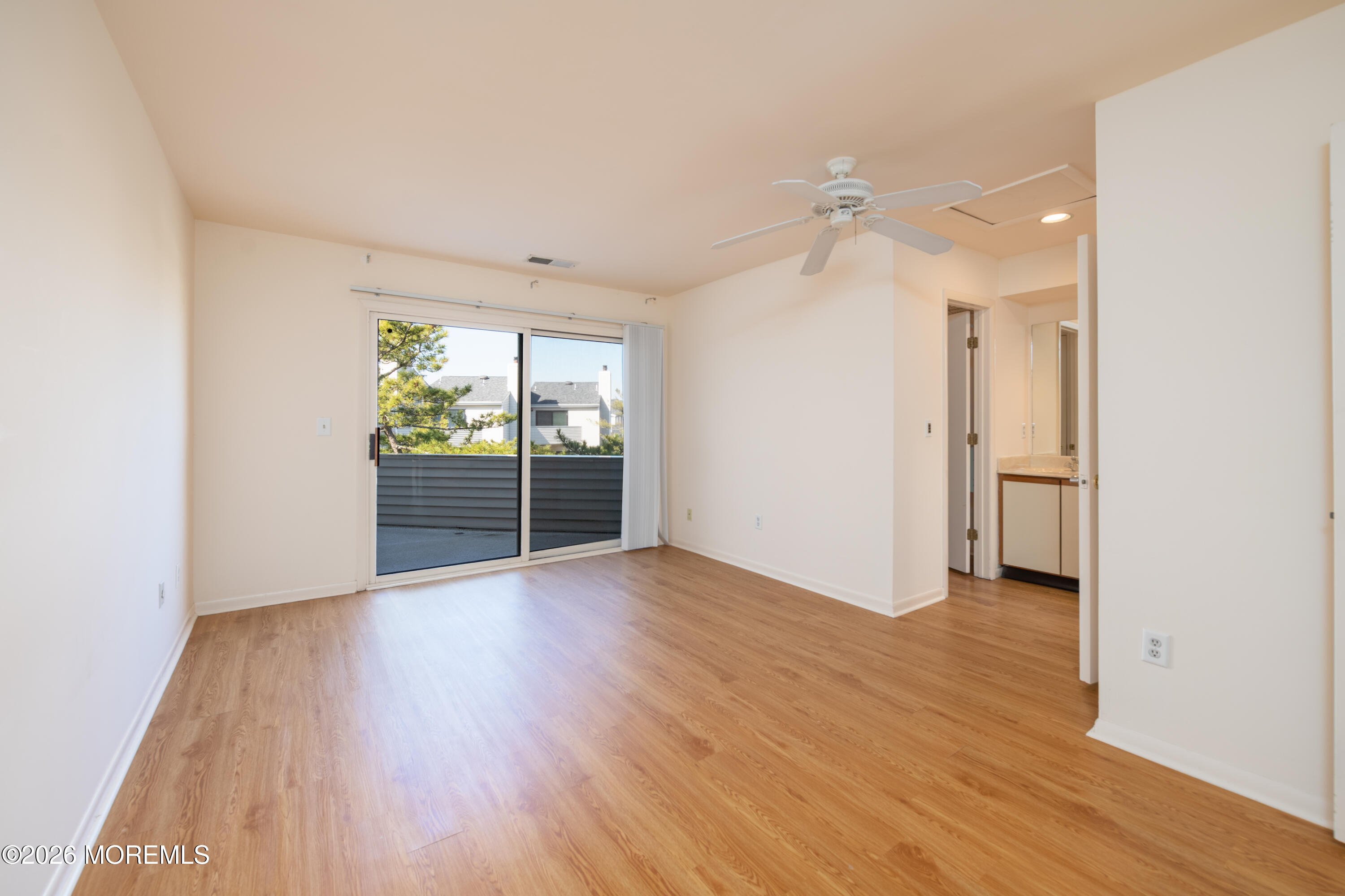 10 Seawinds Way Long Branch, NJ 07740 - Photo 15 of 31 an empty room with wooden floor and windows