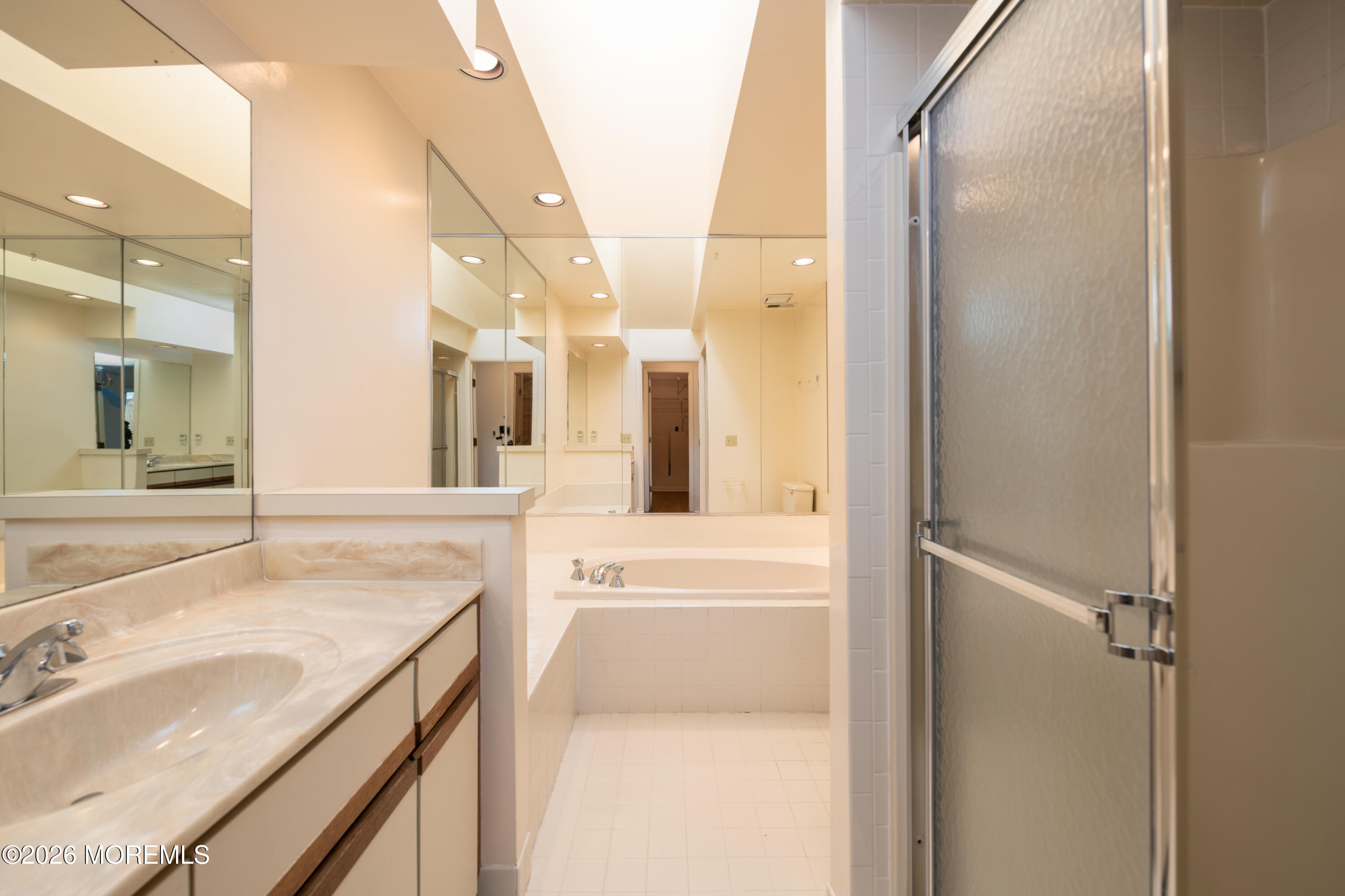 10 Seawinds Way Long Branch, NJ 07740 - Photo 16 of 31 a bathroom with a granite countertop sink mirror and a
