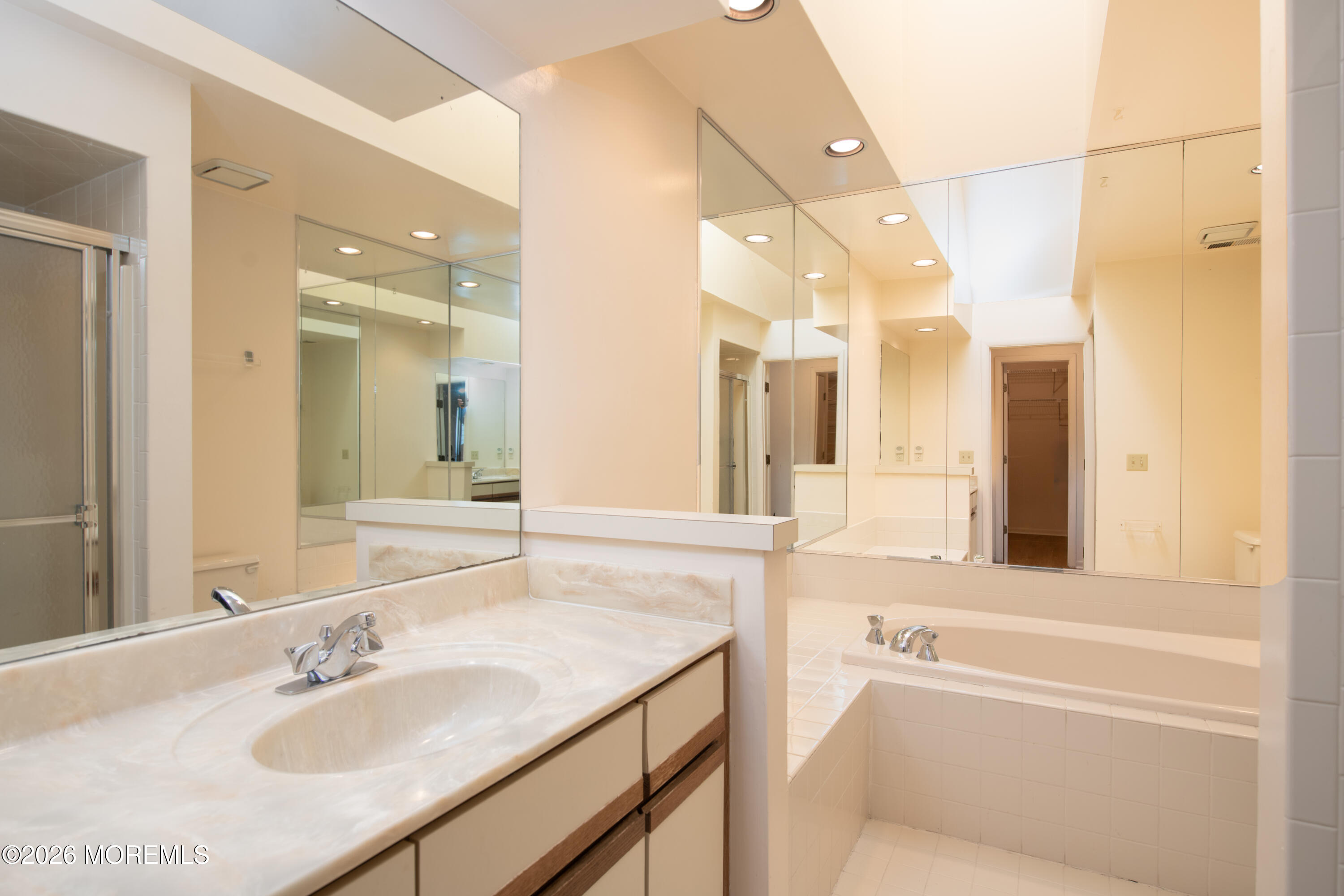 10 Seawinds Way Long Branch, NJ 07740 - Photo 17 of 31 a bathroom with a granite countertop sink mirror and a