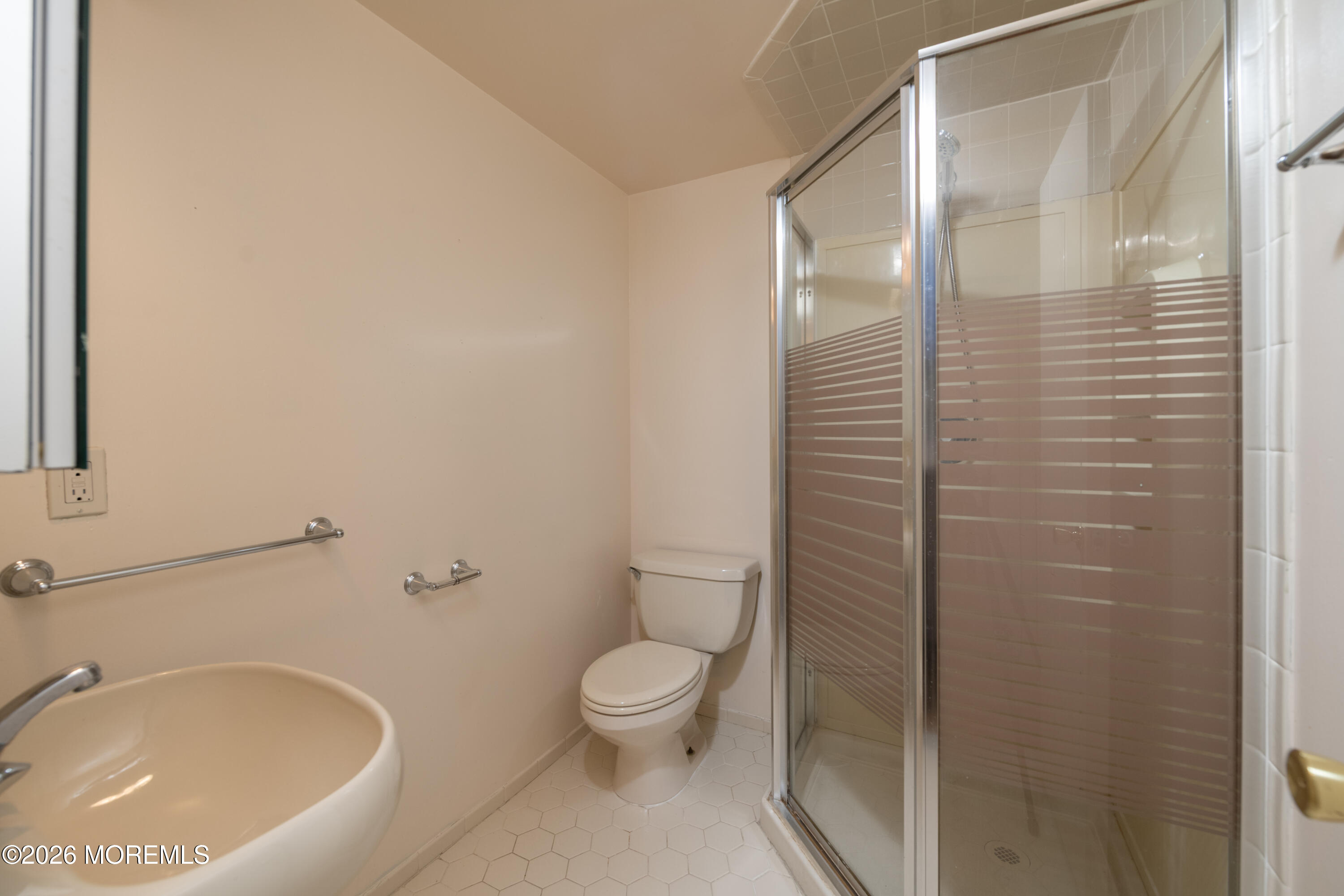 10 Seawinds Way Long Branch, NJ 07740 - Photo 24 of 31 a bathroom with a toilet and a sink
