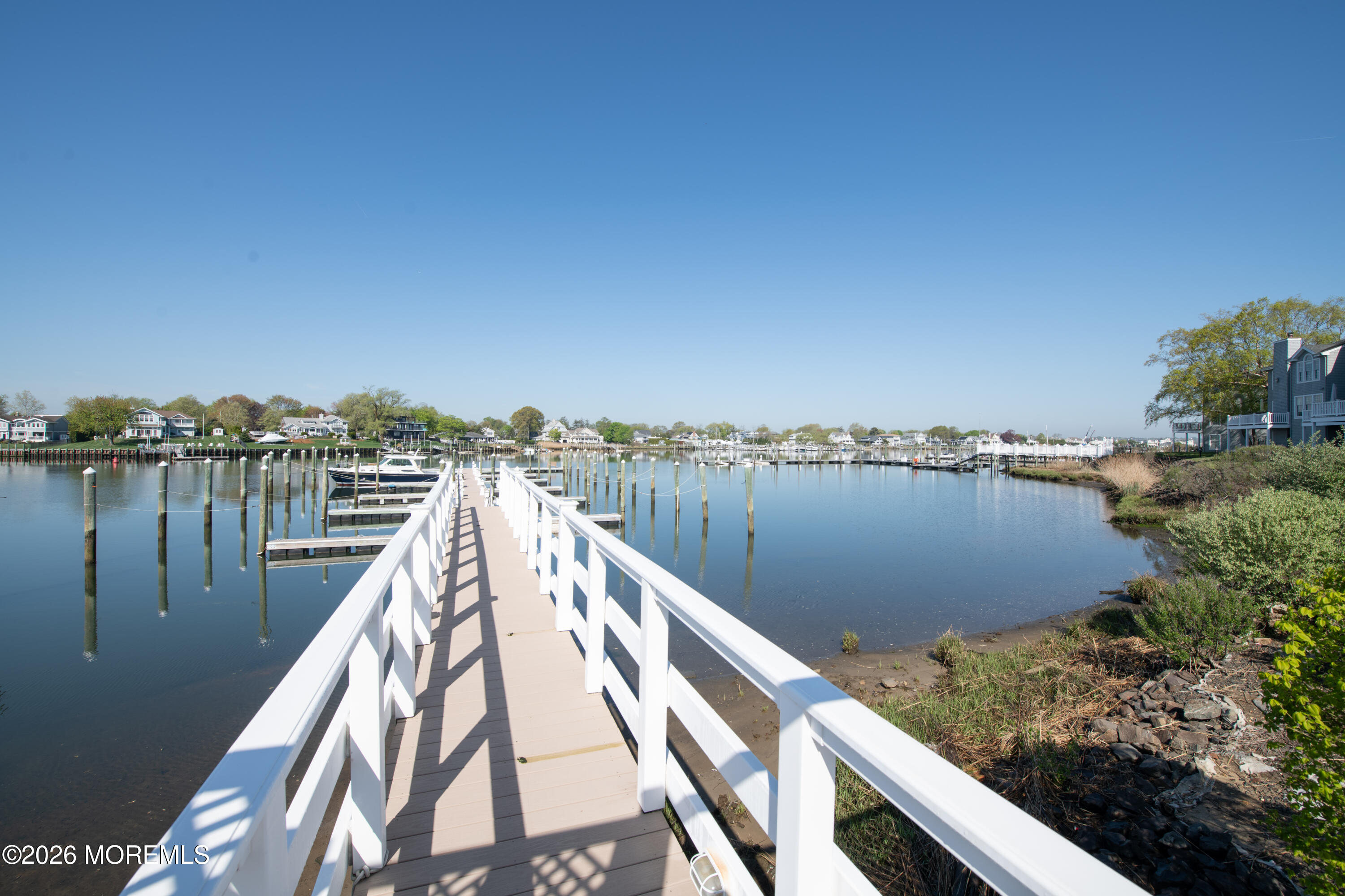 10 Seawinds Way Long Branch, NJ 07740 - Photo 27 of 31 a view of a lake and trees in front of it