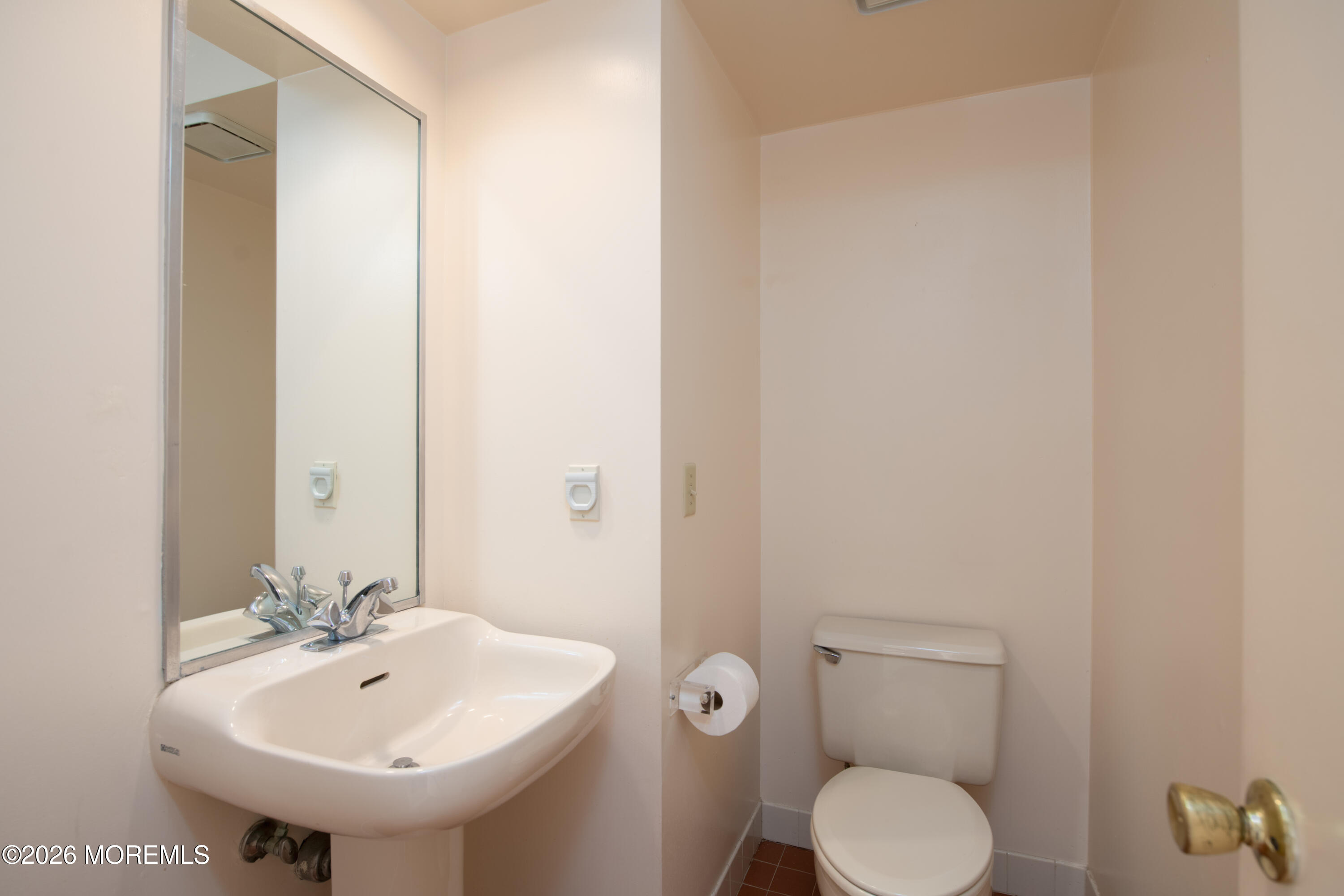 10 Seawinds Way Long Branch, NJ 07740 - Photo 9 of 31 a bathroom with a sink toilet and mirror