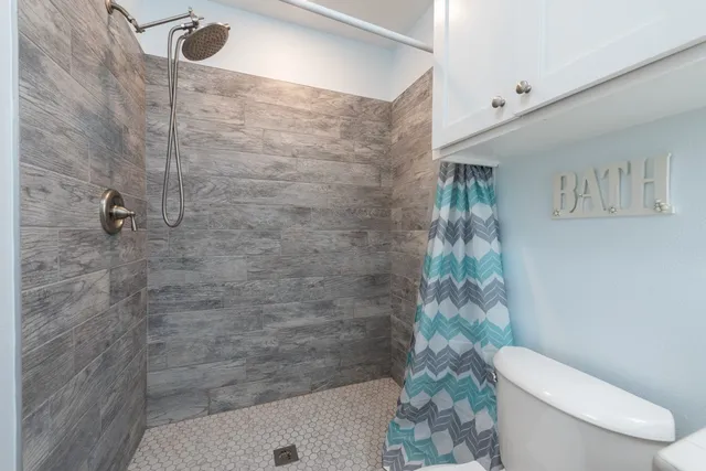 a view of a balcony with wooden floor