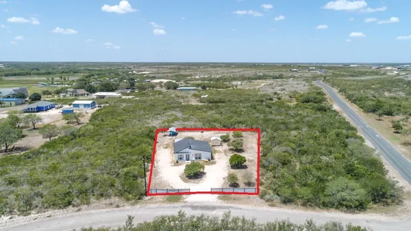 a sign that is sitting on a brick wall