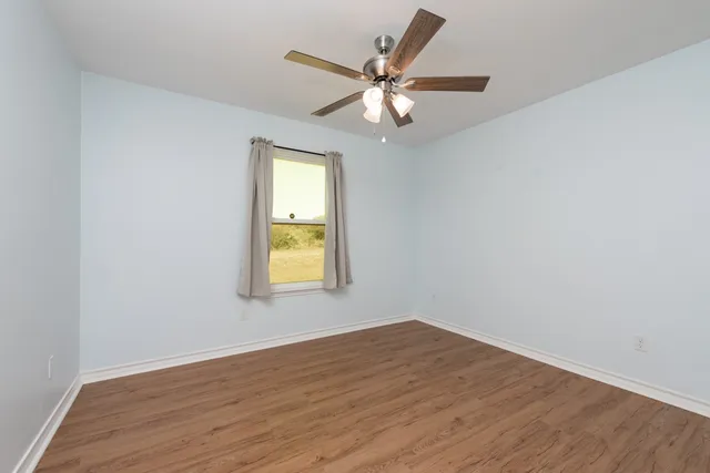 a view of a house with a yard and lake