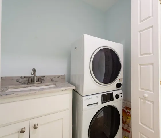 an aerial view of residential houses with outdoor space and river