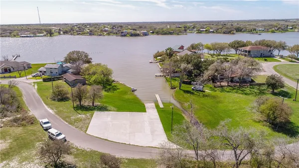 an aerial view of a house with yard