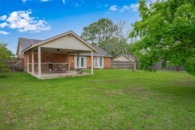 a front view of house with a garden
