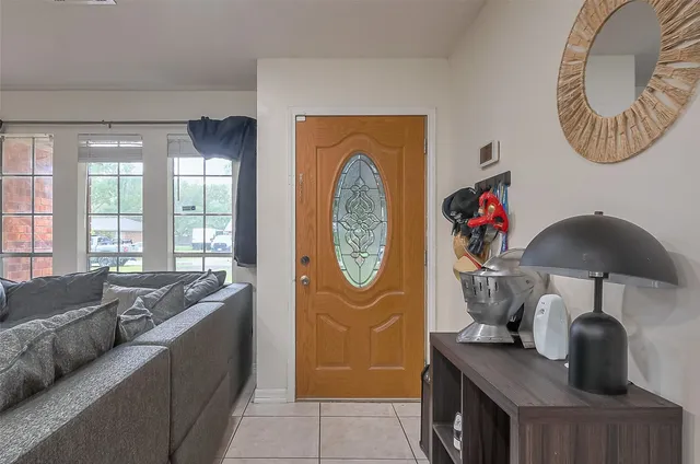 a living room with furniture and a window