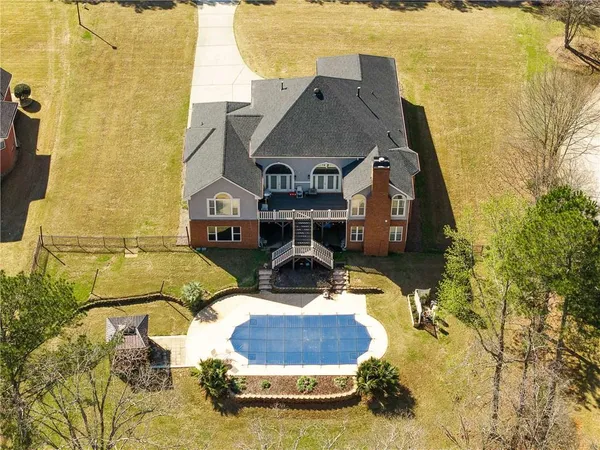 a aerial view of a house with swimming pool