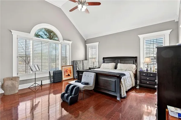 a bedroom with a bed and a tv