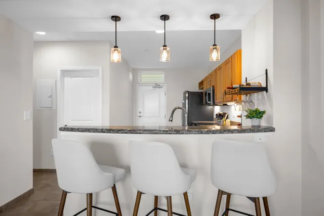 a view of a chair and table in the balcony