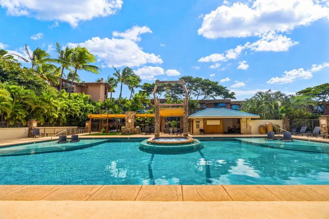 a view of a swimming pool with seating area