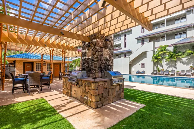 a view of a swimming pool with sitting area