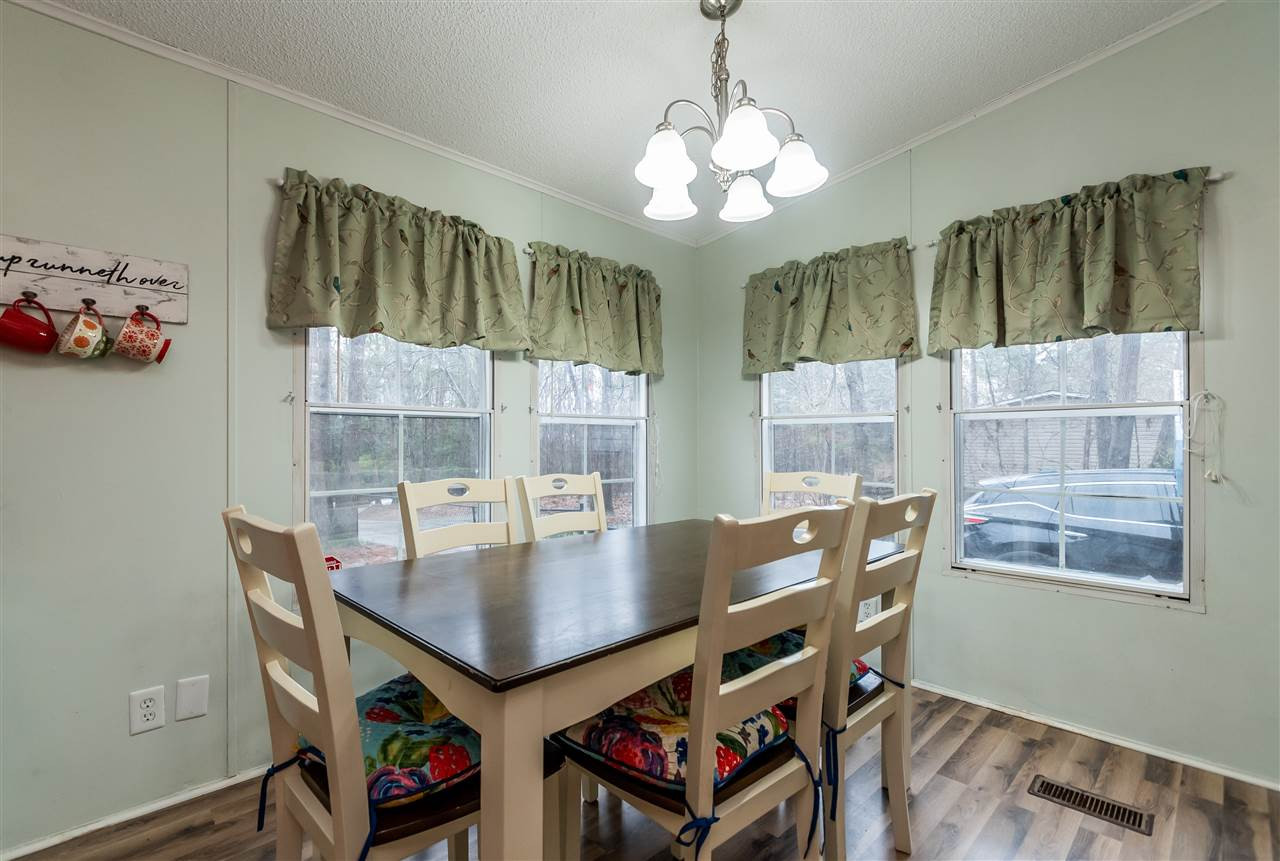 8409 Creek Road Willow Spring, NC 27592 - Photo 15 of 27 Light, roomy dining area easily fits a table that seats six or more! Dining Area